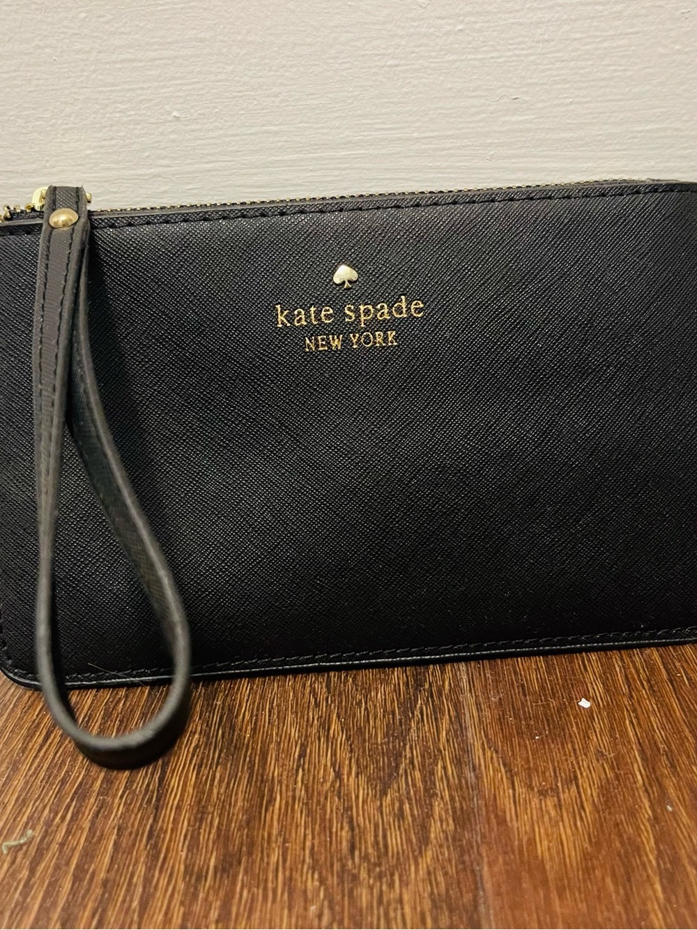kate spade black leather wristlet clutch with gold logo